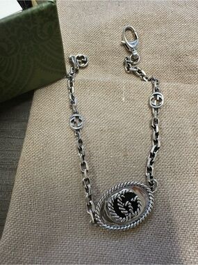 Gucci Silver-Tone Rope Medallion Chain Bracelet with Black Enamel Accent